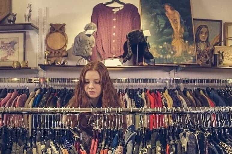 A girl browsing a clothes store